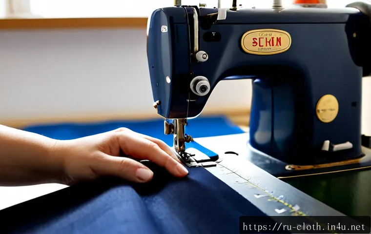 Home 17 의류 봉제 기술 현장 팁 - Photorealistic close-up of an experienced garment seamstress guiding deep navy fabric beneath an ind...